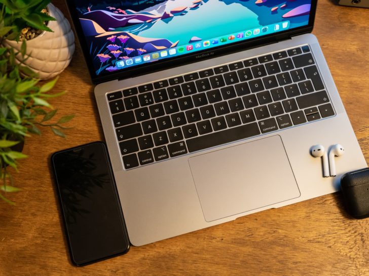 Picture of airpods with macbook air and iphone