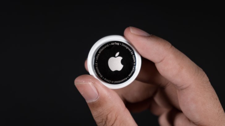 Photo of person holding an airtag