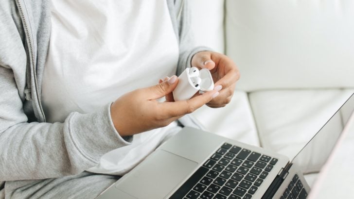 Photo of person holding airpods