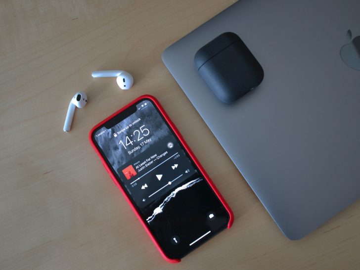 Photo of airpods connected on iphone with music on pause