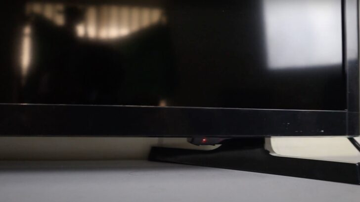 Photo of samsung tv with power button on the right underside