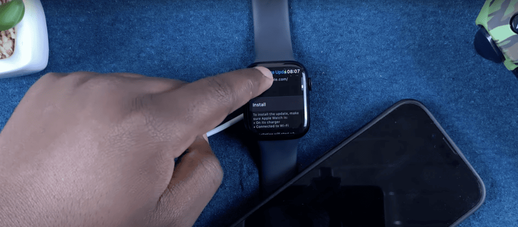 Man scrolling down to his Apple watch setting to install software update