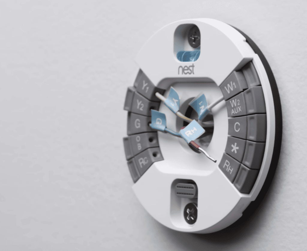 Photo of a Nest thermostat and its wires