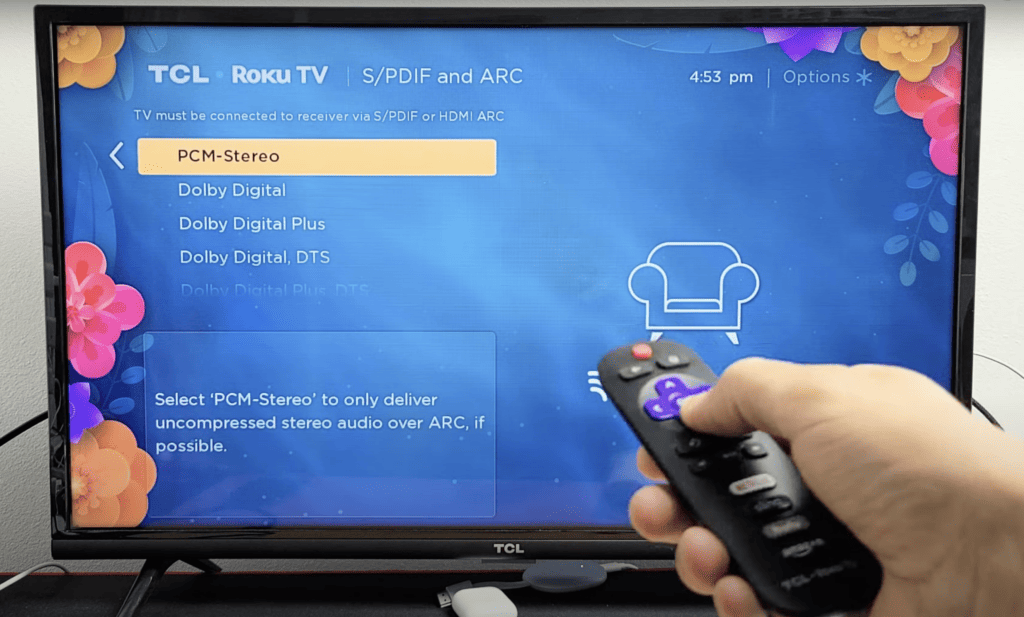 Photo of a person changing the audio output format of a Roku device to PCM Stereo