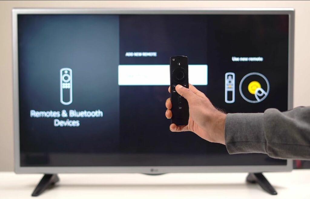hand holding a Firestick remote 