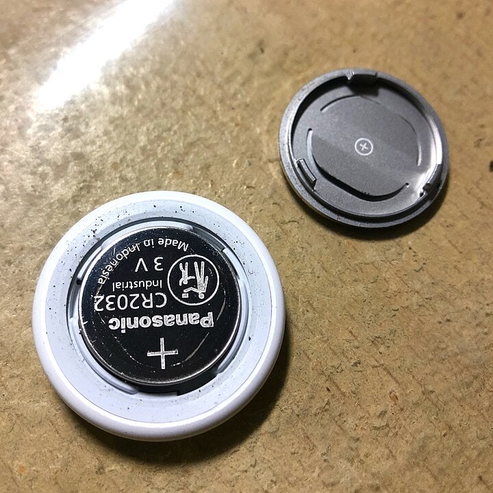 Inside of an AirTag showing its battery