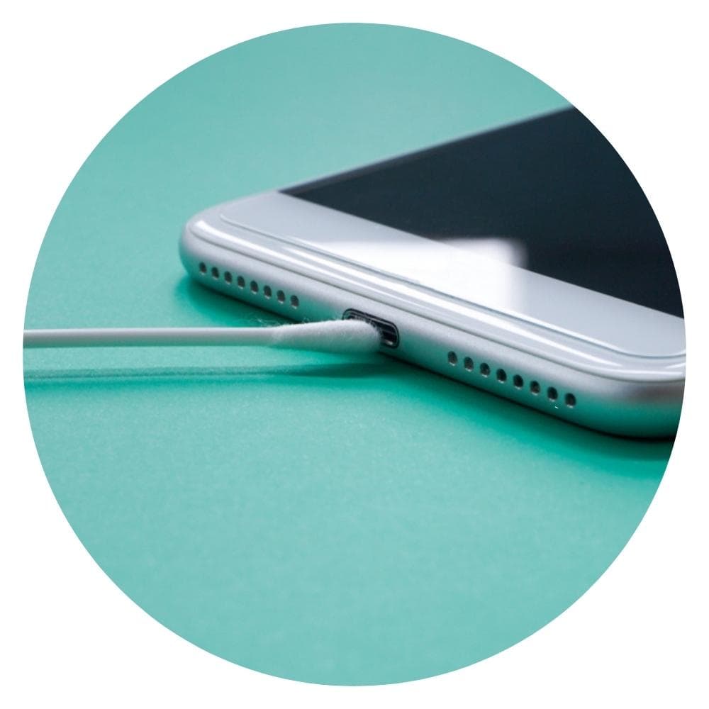 cotton swab inserted on a phone charging port
