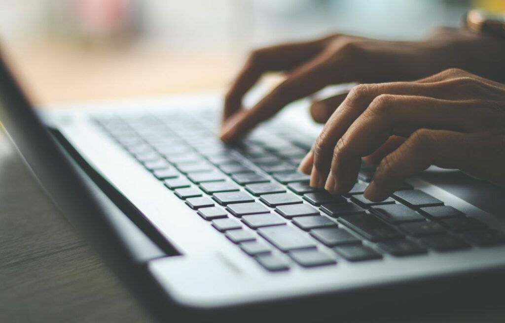 typing on a laptop keyboard
