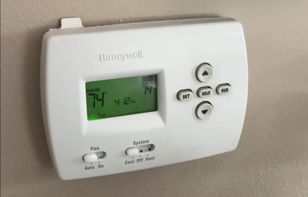 Honeywell 4000 series thermostat on a wall
