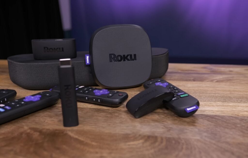 different Roku devices on a wooden table