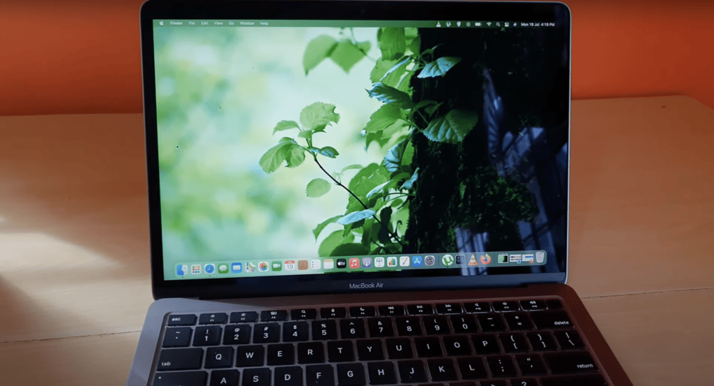 Macbook sitting on a wood with WiFi