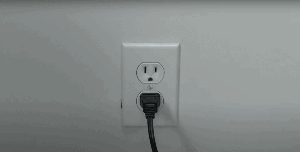 Power outlet of the Toshiba TV on white wall